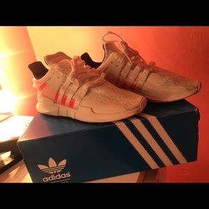 Addidas all white with pink in the back .